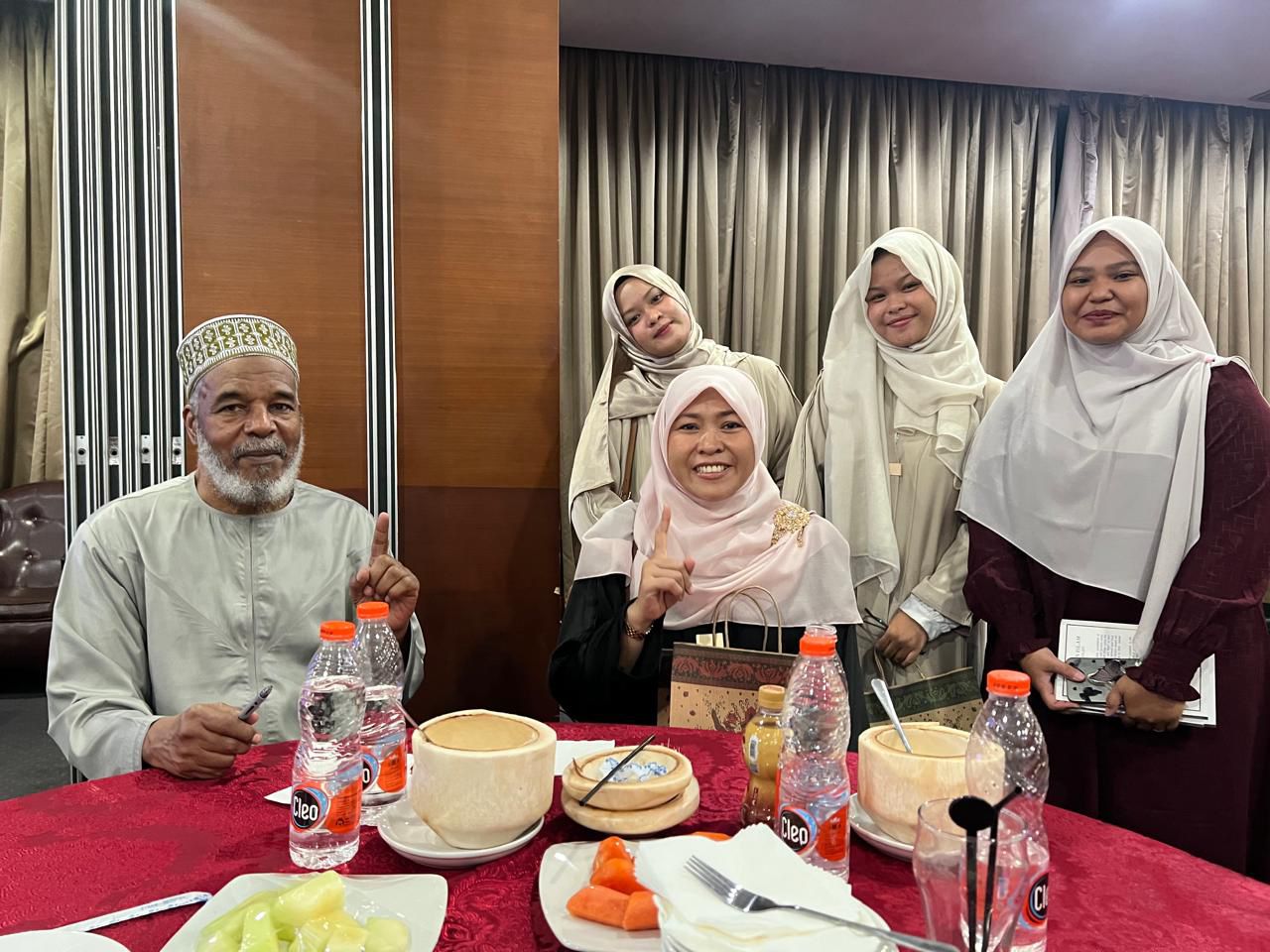 Serene forest pathway with sunlight filtering through green canopies